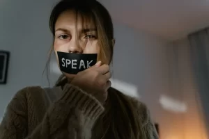 Speaking Fear Covered Mouth.pexels Mart Production 7699405